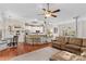 Open-concept living space featuring a kitchen, living room, and dining area at 149 Harbor Landing Dr, Mooresville, NC 28117
