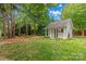 Spacious outbuilding in a private backyard setting, complemented by well-maintained lawn at 149 Harbor Landing Dr, Mooresville, NC 28117
