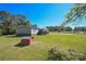 This home features a large back yard with a dog house at 1574 Burke Duncan Rd, Lancaster, SC 29720
