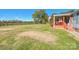 View of home from a side of the yard showing a large yard with the home's porch at 1574 Burke Duncan Rd, Lancaster, SC 29720