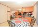 Bright kitchen and dining nook featuring a checkered table setting and convenient access to amenities at 1574 Burke Duncan Rd, Lancaster, SC 29720