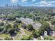 An aerial shot reveals a vibrant community near the cityscape, surrounded by lush greenery and neighborhood streets at 158 Mattoon St, Charlotte, NC 28216