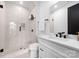 Modern bathroom with a glass-enclosed shower, sleek vanity, and elegant tile work at 158 Mattoon St, Charlotte, NC 28216