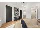 Comfortable bedroom featuring modern art, dark furnishings, and access to the en suite bathroom with streamlined floors at 158 Mattoon St, Charlotte, NC 28216
