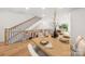 Modern dining room with hardwood floors, contemporary table setting, and modern staircase at 158 Mattoon St, Charlotte, NC 28216