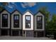 Modern townhomes featuring individual garages and a contemporary design at 158 Mattoon St, Charlotte, NC 28216