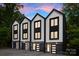 Modern townhomes with a sleek black and white color scheme and eye-catching garage doors at 158 Mattoon St, Charlotte, NC 28216