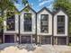 Charming townhomes featuring a modern design, private garages, and sleek black and white accents at 158 Mattoon St, Charlotte, NC 28216