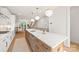 Spacious kitchen with granite countertops, stainless steel appliances, and pendant lighting at 158 Mattoon St, Charlotte, NC 28216