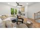 Inviting living room with a cozy fireplace, plush seating, and an abundance of natural light through large windows at 158 Mattoon St, Charlotte, NC 28216