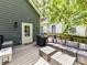 A large deck with outdoor kitchen, seating, and grill at 1605 Allen St, Charlotte, NC 28205