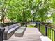 An entertainer's deck with outdoor seating and view of the backyard and shed at 1605 Allen St, Charlotte, NC 28205
