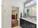Bathroom boasting double sink vanity, modern mirror, and access to bedroom and closet at 1605 Allen St, Charlotte, NC 28205