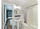 Bright bathroom with a pedestal sink, subway tile, and stylish fixtures at 1605 Allen St, Charlotte, NC 28205
