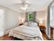 Bright bedroom featuring hardwood floors, two windows and neutral decor at 1605 Allen St, Charlotte, NC 28205