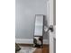 Bedroom door with crystal doorknob opening, mirror, and gray wall at 1605 Allen St, Charlotte, NC 28205