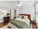 Bedroom with light gray walls, hardwood floors, white trim and ceiling fan at 1605 Allen St, Charlotte, NC 28205