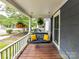 Cozy front porch featuring a swing, hanging plants, and relaxing outdoor space at 1605 Allen St, Charlotte, NC 28205