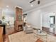Open floor plan showcases the living room with a brick fireplace and hardwood floors at 1605 Allen St, Charlotte, NC 28205