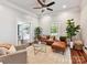 Open concept room with a leather sofa, ceiling fan, and view to the hallway at 1605 Allen St, Charlotte, NC 28205