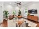 Bright living room with a large window, modern furniture, and a ceiling fan at 1605 Allen St, Charlotte, NC 28205