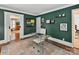 Stylish office space with elegant decor, a modern glass desk, and hardwood floors at 1605 Allen St, Charlotte, NC 28205