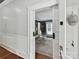 Office features glass desk, white chair, and natural light at 1605 Allen St, Charlotte, NC 28205