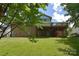 Expansive backyard showcasing a well-maintained lawn and architectural details of the home at 16433 Grapperhall Dr, Huntersville, NC 28078