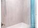 Bathroom featuring stylish tile, shower, tub, and curtain at 16433 Grapperhall Dr, Huntersville, NC 28078
