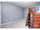 Bedroom featuring a bunk bed, shelving, and soft carpet at 16433 Grapperhall Dr, Huntersville, NC 28078