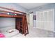 Bedroom featuring a bunk bed with an attached futon and carpeted floors at 16433 Grapperhall Dr, Huntersville, NC 28078