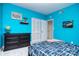Vibrant bedroom with blue walls, modern furniture, and a soft carpet at 16433 Grapperhall Dr, Huntersville, NC 28078