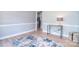 Neutral living room featuring wood floors, fresh paint, and modern decor at 16433 Grapperhall Dr, Huntersville, NC 28078
