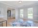 Inviting living room with wood floors, neutral paint, and large windows for ample natural light at 16433 Grapperhall Dr, Huntersville, NC 28078
