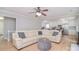 Spacious living room with wood floors, comfortable seating, and open access to the kitchen at 16433 Grapperhall Dr, Huntersville, NC 28078