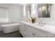 Elegant bathroom featuring double sinks, a marble countertop, vanity, and a standalone soaking tub at 236 Wales Ave, Charlotte, NC 28209