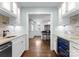 Functional butler's pantry with a sink, wine cooler, and ample counter space at 236 Wales Ave, Charlotte, NC 28209
