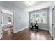 Exercise room featuring hardwood floors, natural light, and an exercise bike at 236 Wales Ave, Charlotte, NC 28209