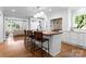 Modern kitchen with a butcher block island, white cabinetry, and stainless steel appliances at 236 Wales Ave, Charlotte, NC 28209