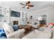 Cozy living room with a fireplace, bookshelves, and an open view into the modern kitchen at 236 Wales Ave, Charlotte, NC 28209