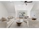 Bright and airy living room featuring neutral decor, large windows, and comfortable seating at 236 Wales Ave, Charlotte, NC 28209