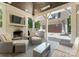 Inviting outdoor living space with a brick fireplace, grill, and comfortable seating at 236 Wales Ave, Charlotte, NC 28209