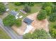 Aerial view of a charming home with a newly paved driveway, complemented by mature trees and landscaping at 251 Hall Spencer Rd, Catawba, SC 29704