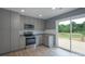 Open concept kitchen with stainless appliances, granite counters, and glass doors to deck at 251 Hall Spencer Rd, Catawba, SC 29704