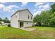 Backyard featuring a lush lawn and a small patio space for outdoor enjoyment at 2903 Rockingham Sw Ct, Concord, NC 28025