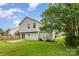 Spacious backyard featuring lush greenery, patio, and exterior view of the home at 2903 Rockingham Sw Ct, Concord, NC 28025