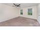 Bedroom with a ceiling fan and two windows offering lots of natural light at 2903 Rockingham Sw Ct, Concord, NC 28025