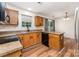 Kitchen area with black appliances, wood cabinets, and breakfast bar at 2903 Rockingham Sw Ct, Concord, NC 28025