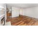 Spacious living room featuring hardwood floors and view into kitchen at 2903 Rockingham Sw Ct, Concord, NC 28025