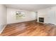 Bright living room with wood floors and a cozy fireplace at 2903 Rockingham Sw Ct, Concord, NC 28025